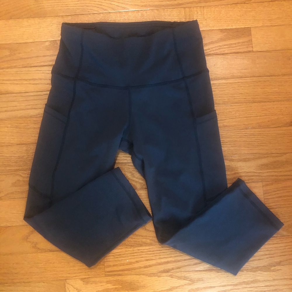 Black cropped leggings, size small. Two front pockets.
